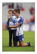 25 September 2011; Monaghan's Amanda Casey with her daughter Emma Casey, aged 7, after defeat against Cork. TG4 All-Ireland Ladies Senior Football Championship Final, Cork v Monaghan, Croke Park, Dublin. Picture credit: Pat Murphy / SPORTSFILE