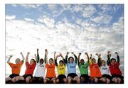 18 August 2011; eFlow employees lift the barriers on community spirit by organising a soccer tournament for kids aged between eight and 11 in Swords, Co, Dublin, this week. Over 240 children will play in 40 soccer games organised by eFlow. This is the second tournament in a series of community initiatives organised and managed by eFlow employees over the past few months. Simon McBeth, Director of eFlow Communications and Customer Relations, said: ‘Our volunteers are delighted to encourage sport and active citizenship in our local communities, helping kids to enjoy themselves and take part in events that promote fun and healthy living. Players from the Swords Celtic team watch the games as they await their next fixture. Swords Celtic pitches, Balheary Reservoir, Swords, Co. Dublin. Picture credit: Brian Lawless / SPORTSFILE