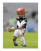 11 July 2011; Goalkeeper with the Longwood GAA Club, Co. Meath, five-year-old, Malachy Fisher pucks out the sliothar during the Leinster GAA Croke Park Activity Days. Croke Park, Dublin. Picture credit: Ray McManus / SPORTSFILE