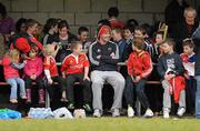 22 December 2011; Munster's Peter O'Mahony sits amongst a group of young supporters during squad training ahead of their Celtic League game against Connacht on Monday. Munster Rugby Squad Training, Kilballyowen Park, Bruff, Co. Limerick. Picture credit: Diarmuid Greene / SPORTSFILE