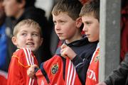 22 December 2011; Munster supporters Sam Williams, aged 9, left, Harry Mullane, aged 10, centre, and Sam Connelly, aged 10, all from Bruree, Co. Limerick, look to get some players' autographs during squad training ahead of their Celtic League game against Connacht on Monday. Munster Rugby Squad Training, Kilballyowen Park, Bruff, Co. Limerick. Picture credit: Diarmuid Greene / SPORTSFILE