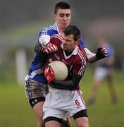 24 December 2011; Kevin O Sé, Dromid Pearses, in action against Daniel Daly, St. Mary's. South Kerry Senior Football Championship Final, St. Mary's v Dromid Pearses, Waterville Sportsfield, Waterville, Co. Kerry. Picture credit: Stephen McCarthy / SPORTSFILE
