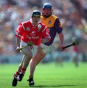 9 August 1998; Alan O'Connor of Cork gets past Nicky Lambert of Wexford during the All-Ireland Minor Hurling Championship Semi-Final match between Cork and Wexford at Croke Park in Dublin. Photo by Ray McManus/Sportsfile