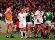 11 October 1998; Referee Andrew Coates sends off Ireland goalkeeper Finbar McConnell after players from both sides were involved in a tussle at the end of the third quarter during the International Rules Series First Test match between Ireland and Australia at Croke Park in Dublin. Photo by Ray Lohan/Sportsfile