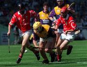 9 August 1998; Anthony Walsh of Wexford is tackled by Barry Murphy, left, and Jason Barrett of Cork during the All-Ireland Minor Hurling Championship Semi-Final match between Cork and Wexford at Croke Park in Dublin. Photo by Ray Lohan/Sportsfile