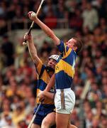 14 September 1997; Brian O'Meara of Tipperary in a tussle for possession with Michael O'Halloran of Clare during the Guinness All-Ireland Hurling Championship Final match between Clare and Tipperary at Croke Park in Dublin. Photo by Ray McManus/Sportsfile