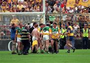 22 August 1998; Offaly players argue with referee Jimmy Cooney after he blew the full-time whistle early at Guinness All-Ireland Hurling All-Ireland Senior Championship Semi-Final Replay match between Clare and Offaly at Croke Park in Dublin. Photo by Ray McManus/Sportsfile