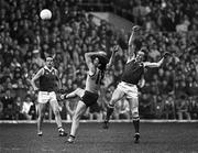 1 November 1987; Paul Roos of Australia, contests an aerial ball with Pat Spillane of Ireland, supported by team-mate Mick Lyons, left, during the International Rules Series Third Test match between Ireland and Australia at Croke Park in Dublin. Photo by Ray McManus/Sportsfile