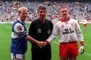 27 September 1998. Referee Michael Curley with team captains Johnny Behan of Laois and Cormac McAnallen of Tyrone before the All-Ireland Minor Football Championship Final between Laois and Tyrone at Croke Park in Dublin. Photo by Ray McManus/Sportsfile