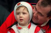 26 April 1998; A young Derry fan enjoys the game with his father during the Church & General National Football League Final match between Derry and Offaly at Croke Park in Dublin. Photo by Ray Lohan/Sportsfile
