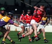 9 August 1998; Donal Broderick of Cork is tackled by Rory Mallon of Wexford during the All-Ireland Minor Hurling Championship Semi-Final match between Cork and Wexford at Croke Park in Dublin. Photo by Brendan Moran/Sportsfile