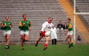 23 March 1997; Peter Canavan of Tyrone on the attack as Meath players Trevor Giles, left, and John McDermott look on during the Church & General National Football League match between Tyrone and Meath at St Tiernach's Park in Clones, Monaghan. Photo by Ray McManus/Sportsfile