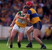 22 August 1998; Joe Erritty of Offaly in action against Brian Lohan of Clare during the Guinness All-Ireland Hurling All-Ireland Senior Championship Semi-Final Replay match between Clare and Offaly at Croke Park in Dublin. Photo by Ray McManus/Sportsfile