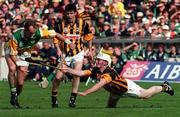 13 September 1998; Joe Dooley of Offaly is tackled by Tom Hickey of Kilkenny, as Philly Larkin, centre, looks on during the Guinness All-Ireland Senior Hurling Championship Final match between Kilkenny and Offaly at Croke Park in Dublin. Photo by Brendan Moran/Sportsfile