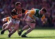 13 September 1998; Michael Duignan of Offaly is tackled by Charlie Carter of Kilkenny during the Guinness All-Ireland Senior Hurling Championship Final match between Kilkenny and Offaly at Croke Park in Dublin. Photo by Ray McManus/Sportsfile