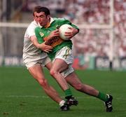 30 August 1998; Liam Brosnan of Kerry is tackled by John Finn of Kildare during the Bank of Ireland All-Ireland Senior Football Championship Semi-Final match between Kerry and Kildare at Croke Park in Dublin. Photo by Brendan Moran/Sportsfile