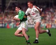30 August 1998; Liam Brosnan of Kerry is tackled by John Finn of Kildare during the Bank of Ireland All-Ireland Senior Football Championship Semi-Final match between Kerry and Kildare at Croke Park in Dublin. Photo by Brendan Moran/Sportsfile