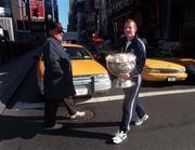 18 October 1997; A Long Way from Killorgan. Kerry captain Liam Hassett carries the Sam Maguire Cup through Times Square on the morning before the Church and General National Football League match between Cavan and Kerry at Downing Stadium, Randall's Island, New York, USA. Photo by Ray McManus/Sportsfile