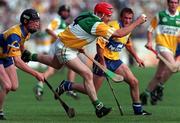 29 August 1998; Martin Hanamy of Offaly in action against Niall Gilligan, left, and Alan Markham of Clare during the Guinness All-Ireland Senior Hurling Championship Semi-Final Refixture match between Clare and Offaly at Semple Stadium in Thurles, Tipperary. Photo by Ray McManus/Sportsfile