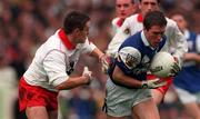 27 September 1998; Michael Clancy of Laois in action against Michael McGee of Tyrone during the All-Ireland Minor Football Championship Final between Laois and Tyrone at Croke Park in Dublin. Photo by Brendan Moran/Sportsfile