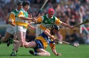 29 August 1998; Niall Gilligan of Clare in action against Offaly players, from left, Hubert Rigney, Brian Whelahan and Martin Hanamy during the Guinness All-Ireland Senior Hurling Championship Semi-Final Refixture match between Clare and Offaly at Semple Stadium in Thurles, Tipperary. Photo by Ray McManus/Sportsfile