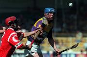 9 August 1998; Nicky Lambert of Wexford is tackled by Eoin O'Sullivan of Cork during the All-Ireland Minor Hurling Championship Semi-Final match between Cork and Wexford at Croke Park in Dublin. Photo by Ray McManus/Sportsfile