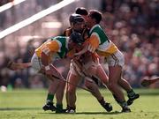 13 September 1998; Peter Barry of Kilkenny, supported by team-mate Philip Larkin, behind, in action against Billy Dooley, left, and Johnny Dooley of Offaly during the Guinness All-Ireland Senior Hurling Championship Final match between Kilkenny and Offaly at Croke Park in Dublin. Photo by Ray McManus/Sportsfile