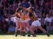 13 September 1998; Paudie Mulhare of Offaly is tackled by Kilkenny players Michael Kavanagh and Canice Brennan, right, during the Guinness All-Ireland Senior Hurling Championship Final match between Kilkenny and Offaly at Croke Park in Dublin. Photo by Ray McManus/Sportsfile