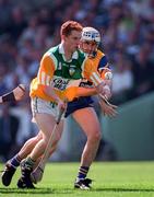 9 August 1998; Simon Whelahan of Offaly in action against Ger O'Loughlin of Clare during the Guinness All-Ireland Senior Hurling Championship Semi-Final match between Clare and Offaly at Croke Park in Dublin. Photo by Brendan Moran/Sportsfile