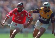 9 August 1998; Victor Cusack of Cork is tackled by David O'Connell of Wexford during the All-Ireland Minor Hurling Championship Semi-Final match between Cork and Wexford at Croke Park in Dublin. Photo by Brendan Moran/Sportsfile