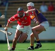 9 August 1998; Victor Cusack of Cork is tackled by David O'Connor of Wexford during the All-Ireland Minor Hurling Championship Semi-Final match between Cork and Wexford at Croke Park in Dublin. Photo by Ray McManus/Sportsfile