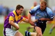 1 June 2002; Diarmuid Kinsella of Wexford is tackled by Dublin's Shane Ryan during the Bank of Ireland Leinster Senior Football Championship Quarter-Final match between Wexford and Dublin at Dr. Cullen Park in Carlow. Photo by Damien Eagers/Sportsfile