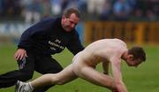 1 June 2002; A match official tries to apprehend a streaker during the Bank of Ireland Leinster Senior Football Championship Quarter-Final match between Wexford and Dublin at Dr. Cullen Park in Carlow. Photo by Matt Browne/Sportsfile