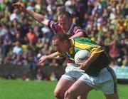 2 June 2002; Adrian Kenny of Meath in action against Westmeath's Dermot Brady during the Bank of Ireland Leinster Senior Football Championship Quarter-Final match between Meath and Westmeath at O'Moore Park in Portlaoise, Laois. Photo by Matt Browne/Sportsfile