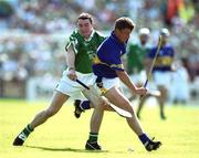 2 June 2002; Noel Morris of Tipperary is tackled by Peter Lawlor of Limerick during the Guinness Munster Senior Hurling Championship Semi-Final match between Tipperary and Limerick at Páirc U’ Chaoimh in Cork. Photo by Brendan Moran/Sportsfile