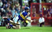 2 June 2002; Brendan Dunne of Tipperary gets the sliotar away despite the attentions of Stephen Lucey of Limerick during the Guinness Munster Senior Hurling Championship Semi-Final match between Tipperary and Limerick at Páirc U’ Chaoimh in Cork. Photo by Brendan Moran/Sportsfile