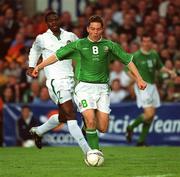 16 May 2002; Matt Holland of Republic of Ireland in action against Joseph Yobo of Nigeria during the International Friendly match between Republic of Ireland and Nigeria at Lansdowne Road in Dublin. Photo by David Maher/Sportsfile
