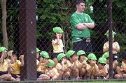 3 June 2002; A Republic of Ireland supporter and local school children watch during a Republic of Ireland training session in Chiba, Japan. Photo by David Maher/Sportsfile