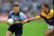 1 June 2002; Dessie Farrell of Dublin in action against Philip Wallace of Wexford during the Bank of Ireland Leinster Senior Football Championship Quarter-Final match between Wexford and Dublin at Dr. Cullen Park in Carlow. Photo by Damien Eagers/Sportsfile