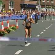 3 June 2002; Pauline Curley from Tullamore, Co. Offaly crosses the line to win the Tesco Evening Herald Women's Mini Marathon in Dublin. Photo by Ray McManus/Sportsfile