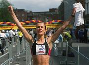 3 June 2002; Pauline Curley from Tullamore, Co. Offaly celebrates after winning the Tesco Evening Herald Women's Mini Marathon in Dublin. Photo by Ray McManus/Sportsfile