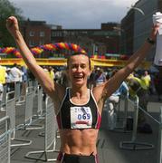 3 June 2002; Pauline Curley from Tullamore, Co. Offaly celebrates after winning the Tesco Evening Herald Women's Mini Marathon in Dublin. Photo by Ray McManus/Sportsfile