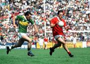 1 July 1990; Cork's Danny Culloty races clear of Kerry's Morgan Nix during the Munster Senior Football Championship Final match between Cork and Kerry at Pairc Ui Chaoimh in Cork. Photo by Ray McManus/Sportsfile