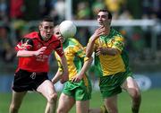 2 June 2002; Jim McGuinness of Donegal in action against Alan Molloy of Down during the Bank of Ireland Ulster Senior Football Championship Quarter-Final match between Donegal and Down at MacCumhail Park in Ballybofey, Donegal. Photo by Damien Eagers/Sportsfile