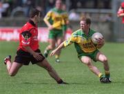 2 June 2002; Brian Roper of Donegal in action against Liam Doyle of Down during the Bank of Ireland Ulster Senior Football Championship Quarter-Final match between Donegal and Down at MacCumhail Park in Ballybofey, Donegal. Photo by Damien Eagers/Sportsfile