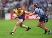 1 June 2002; David Murphy of Wexford is tackled by Dublin's Shane Ryan during the Bank of Ireland Leinster Senior Football Championship Quarter-Final match between Wexford and Dublin at Dr. Cullen Park in Carlow. Photo by Damien Eagers/Sportsfile