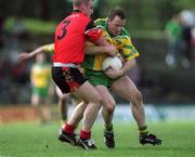 2 June 2002; Adrian Sweeney of Donegal in action against Ciaran Byrne of Down during the Bank of Ireland Ulster Senior Football Championship Quarter-Final match between Donegal and Down at MacCumhail Park in Ballybofey, Donegal. Photo by Damien Eagers/Sportsfile