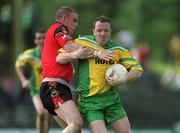 2 June 2002; Adrian Sweeney of Donegal in action against Ciaran Byrne of Down during the Bank of Ireland Ulster Senior Football Championship Quarter-Final match between Donegal and Down at MacCumhail Park in Ballybofey, Donegal. Photo by Damien Eagers/Sportsfile
