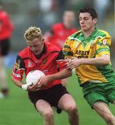 2 June 2002; Brendan Coulter of Down in action against Christy Toye of Donegal during the Bank of Ireland Ulster Senior Football Championship Quarter-Final match between Donegal and Down at MacCumhail Park in Ballybofey, Donegal. Photo by Damien Eagers/Sportsfile