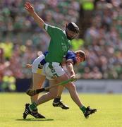 2 June 2002; Brian Geary of Limerick in action against Tipperary's Brian O'Meara during the Guinness Munster Senior Hurling Championship Semi-Final match between Tipperary and Limerick at Páirc U’ Chaoimh in Cork. Photo by Brendan Moran/Sportsfile